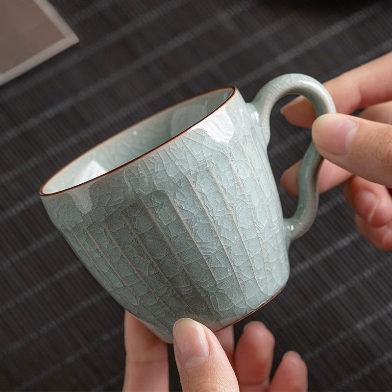Artisan coffee cup with unique handle design