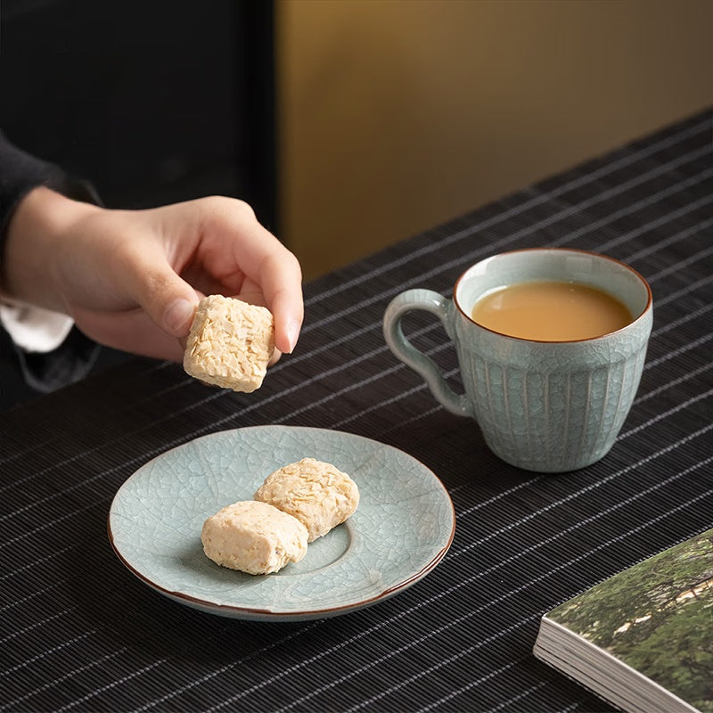 Artisan coffee cup with unique handle design