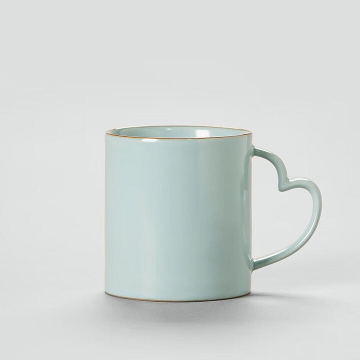 Artisan coffee cup with unique handle design