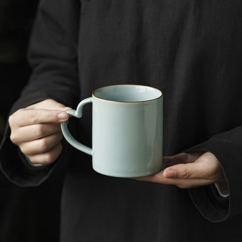 Artisan coffee cup with unique handle design