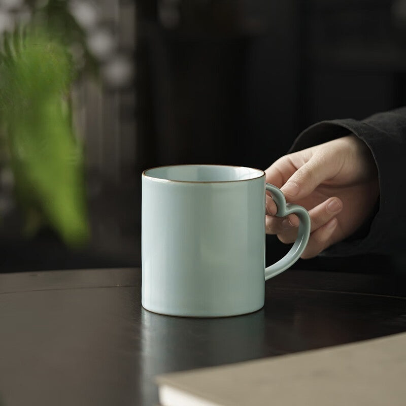 Artisan coffee cup with unique handle design